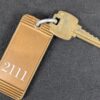 Vintage Falcon Hotel Room Key Tag 2111 Honolulu Hawaii Gold Brown Metal Colle...