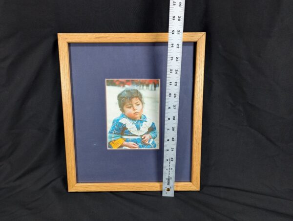 10-1195.jpg Framed Color Photograph Peruvian Girl Blue Plaid Dress 14x17 Oak Style Frame