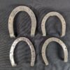 Set of Four Metal Horseshoes with Calks Equestrian Hardware Silver Tone Decor...