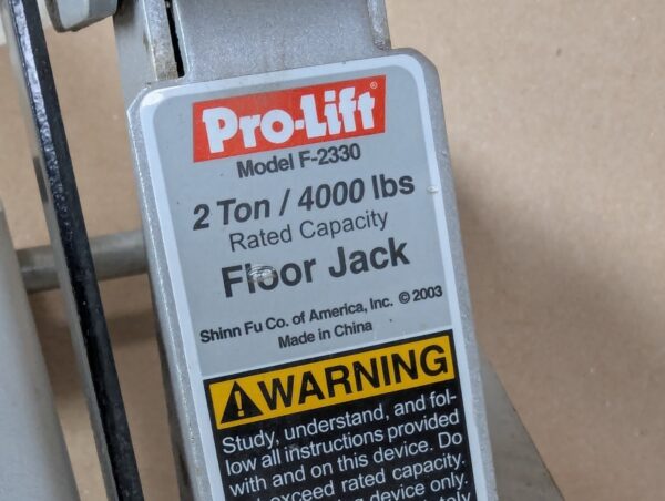 10-2735.jpg Pro-Lift F-2330 2-Ton Hydraulic Floor Jack 4000lb Capacity 2003 Silver Red Black