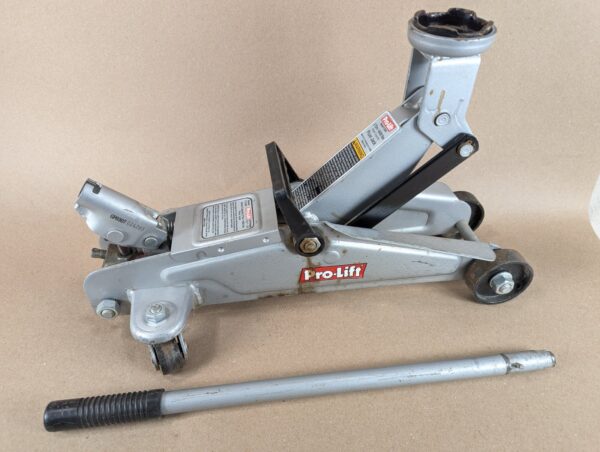 10-2737.jpg Pro-Lift F-2330 2-Ton Hydraulic Floor Jack 4000lb Capacity 2003 Silver Red Black