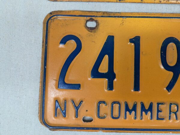 Vintage New York Commercial License Plate Pair 1970s Orange and Blue Metal Decor