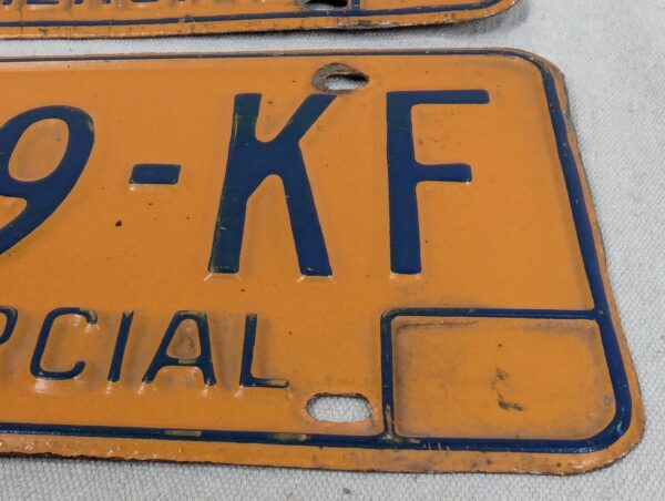 Vintage New York Commercial License Plate Pair 1970s Orange and Blue Metal Decor