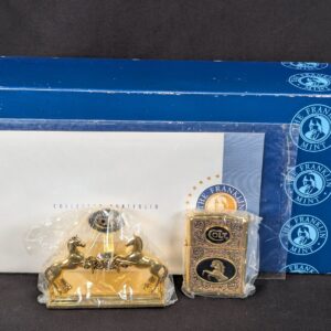 The Franklin Mint Spirit of the Old West Gold-Tone Lighter and Display Stand Set