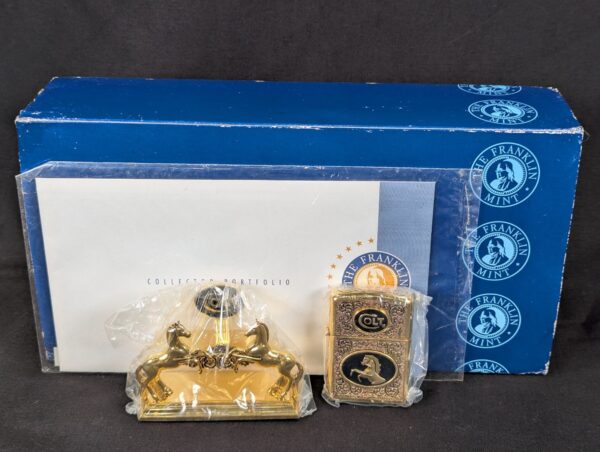 The Franklin Mint Spirit of the Old West Gold-Tone Lighter and Display Stand Set