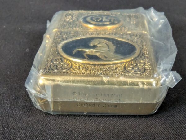 The Franklin Mint Spirit of the Old West Gold-Tone Lighter and Display Stand Set