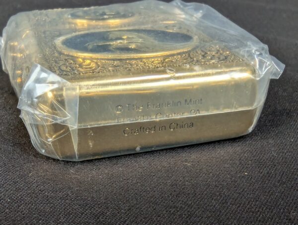 The Franklin Mint Spirit of the Old West Gold-Tone Lighter and Display Stand Set