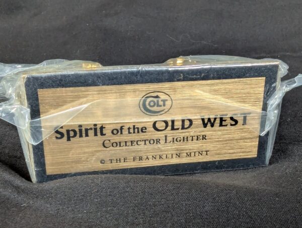The Franklin Mint Spirit of the Old West Gold-Tone Lighter and Display Stand Set