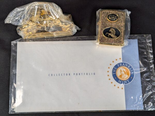 The Franklin Mint Spirit of the Old West Gold-Tone Lighter and Display Stand Set