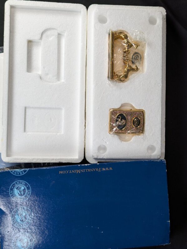 The Franklin Mint Spirit of the Old West Gold-Tone Lighter and Display Stand Set
