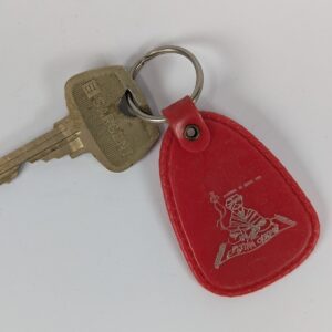 Flying Carpet Motel Room Key with Plastic Keychain White Text Metal Key Tag