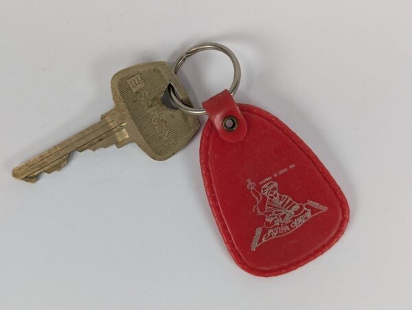 Flying Carpet Motel Room Key with Plastic Keychain White Text Metal Key Tag