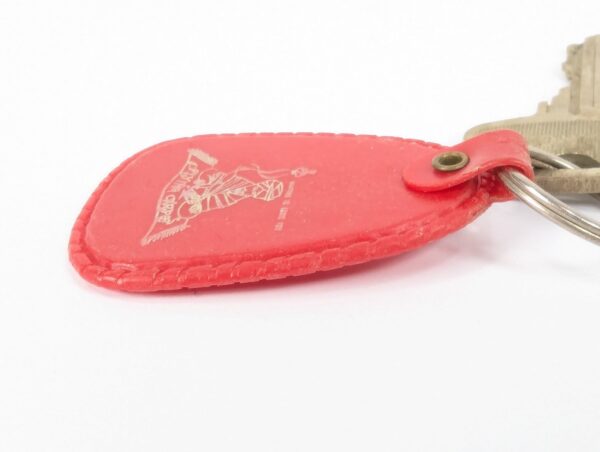 Flying Carpet Motel Room Key with Plastic Keychain White Text Metal Key Tag