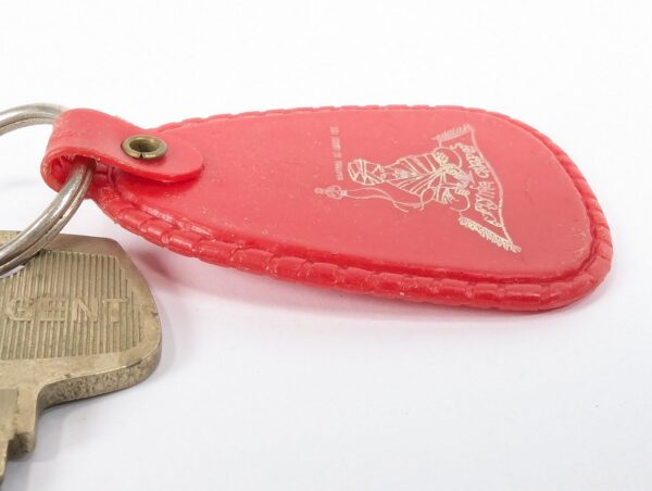 Flying Carpet Motel Room Key with Plastic Keychain White Text Metal Key Tag